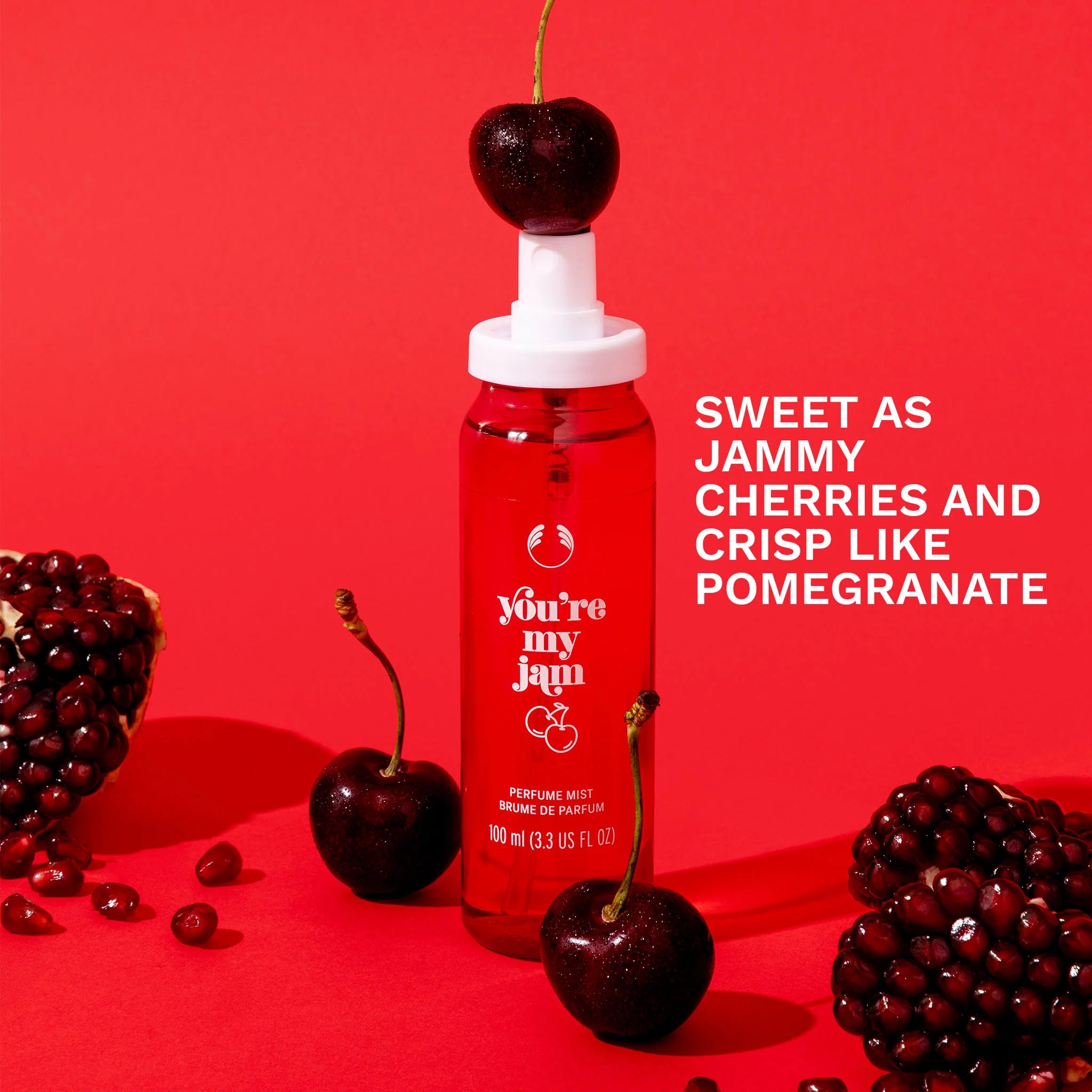 Red bottle with cherry on top against a red background, featuring text about flavor description.