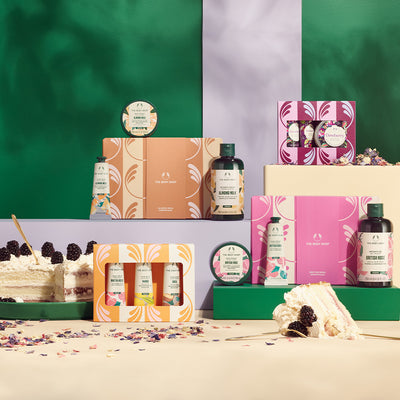 Collection of beauty products and cakes on a colorful background