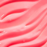 Close-up of pink, glossy lip balm.
