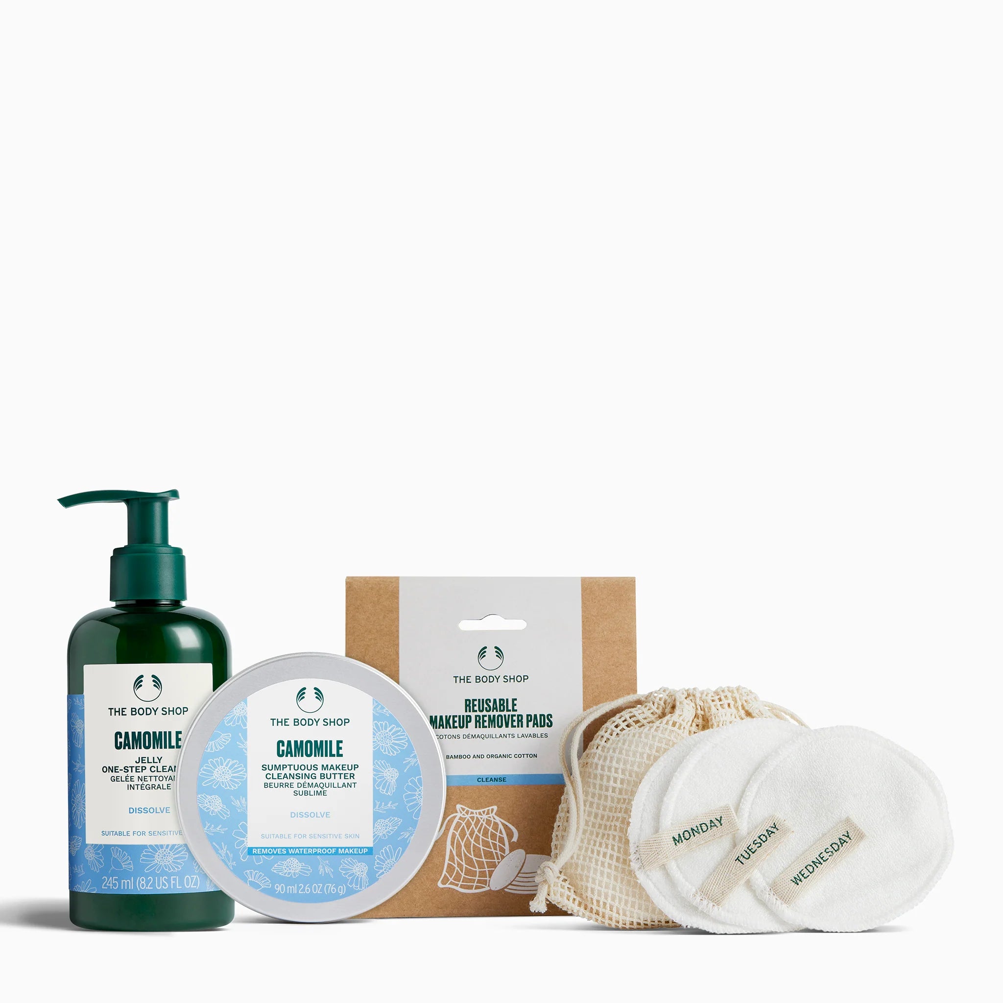 Collection of The Body Shop skincare products including a bottle, jar, and reusable makeup remover pads on a white background.