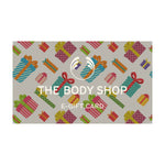 The Body Shop e-gift card with colorful gift box pattern on a beige background