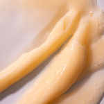 Close-up of legs with a beige color on a light background