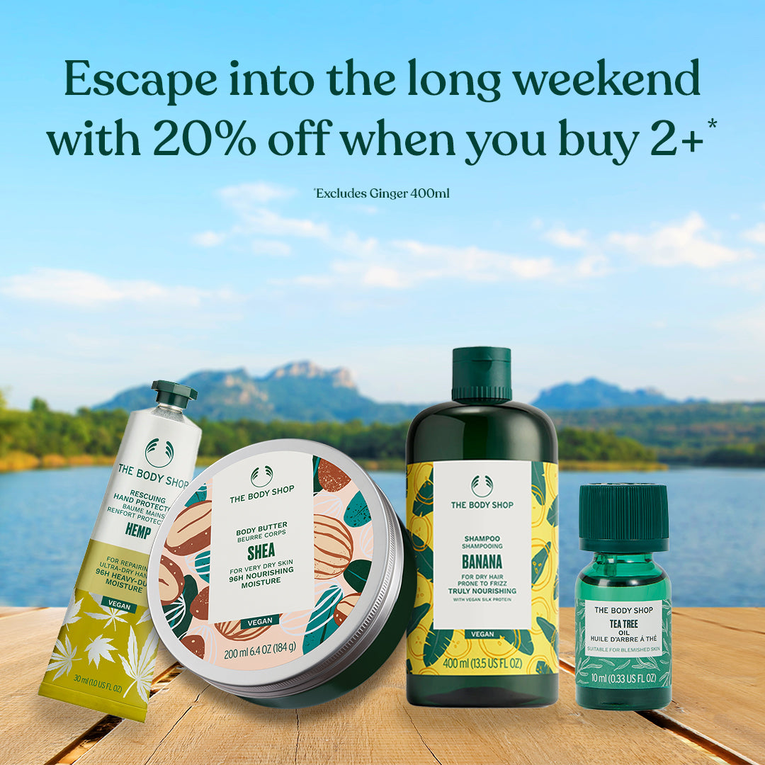 Body care products on a wooden surface with a scenic background