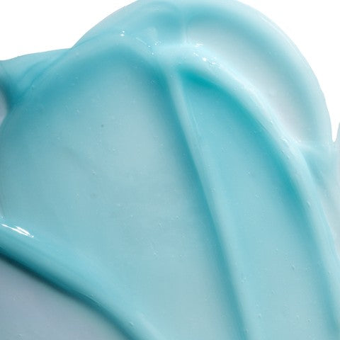 Close up of a light blue cream swatch on a white background