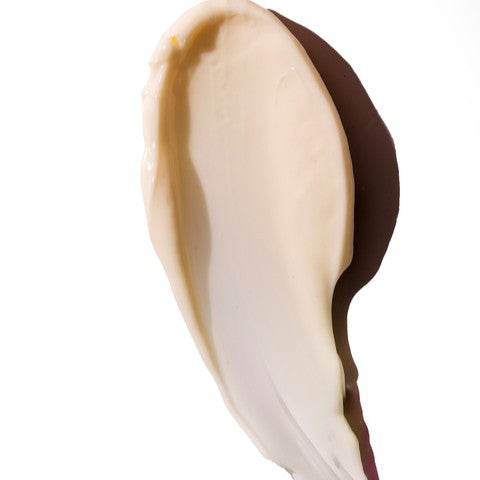 Close up of a cream spread on a white background