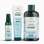 The Body Shop peppermint product set including foot cream, shower gel, and spray on a white background.