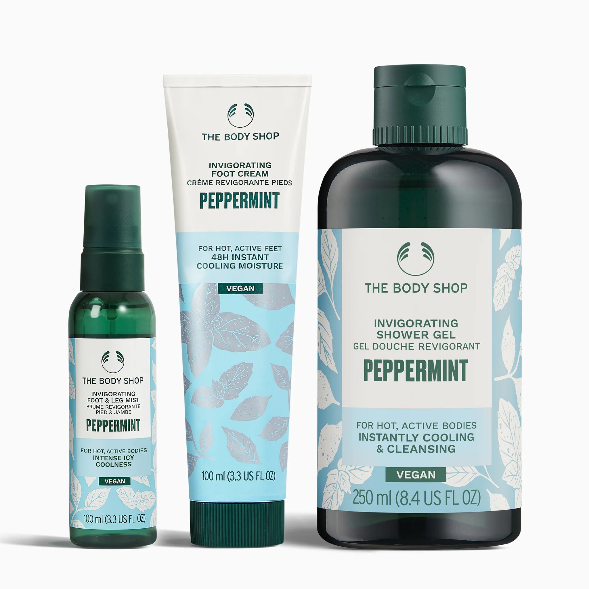 The Body Shop peppermint product set including foot cream, shower gel, and spray on a white background.