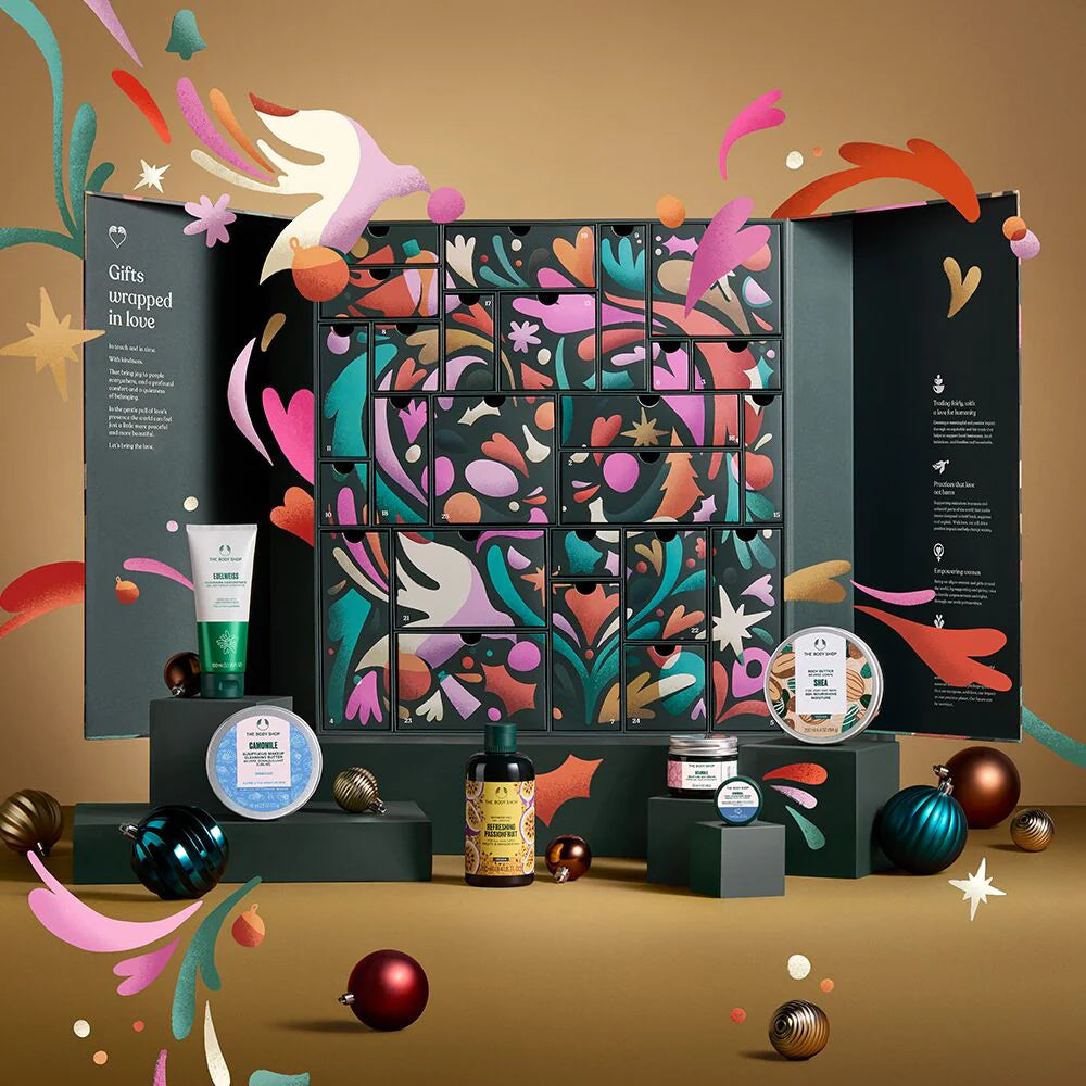 Decorative advent calendar with colorful design and small products on a beige background