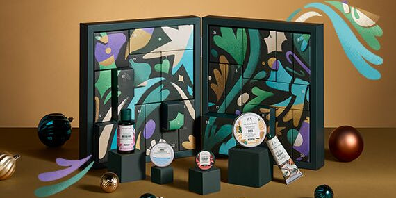 Cosmetic advent calendar with colorful design on a brown background