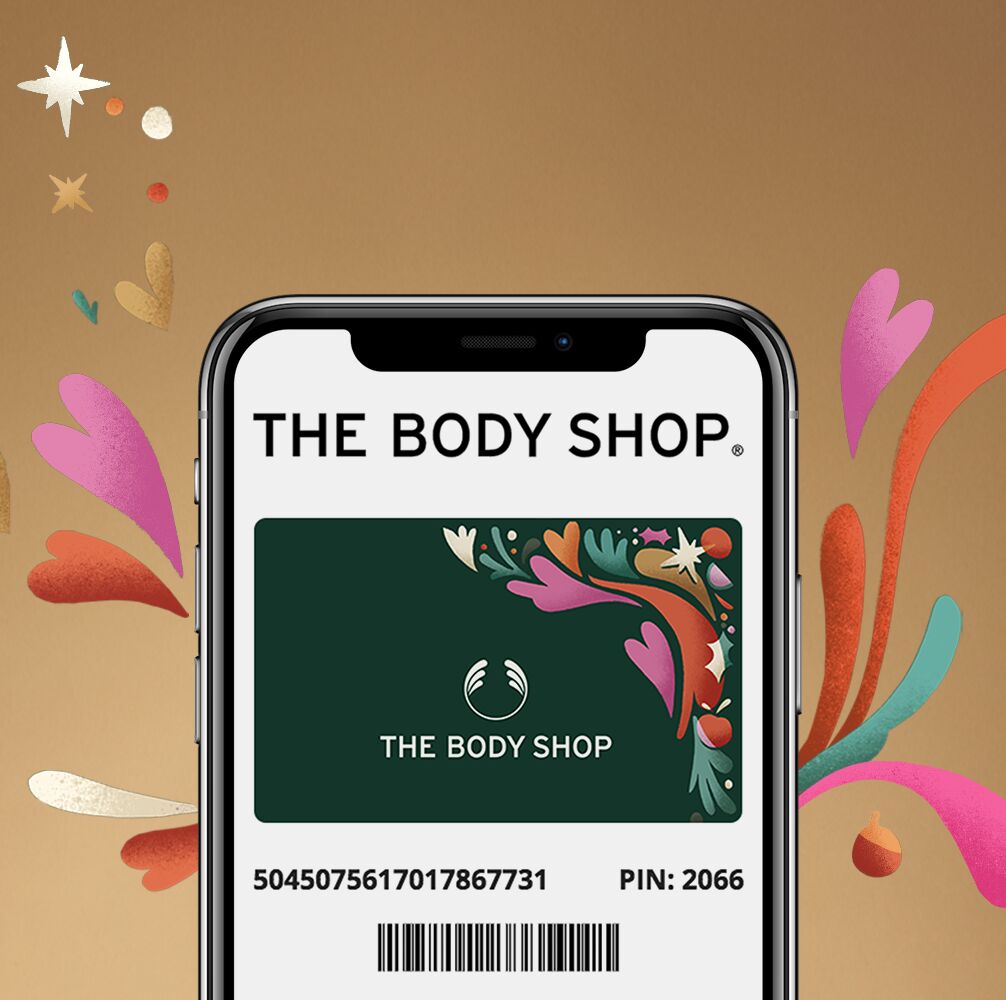Phone displaying The Body Shop label with decorative elements on a brown background