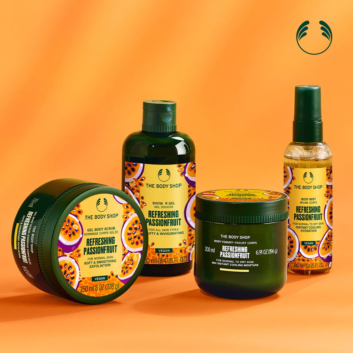 The Body Shop Refreshing Passionfruit product set on an orange background