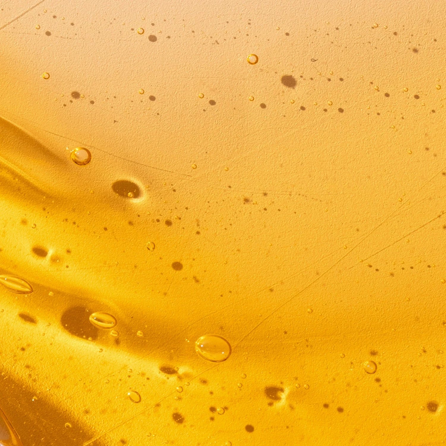 Close-up of yellow liquid with bubbles