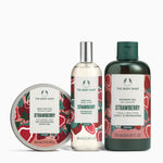 The Body Shop Strawberry products including the body butter, body mist and shower gel on a white background