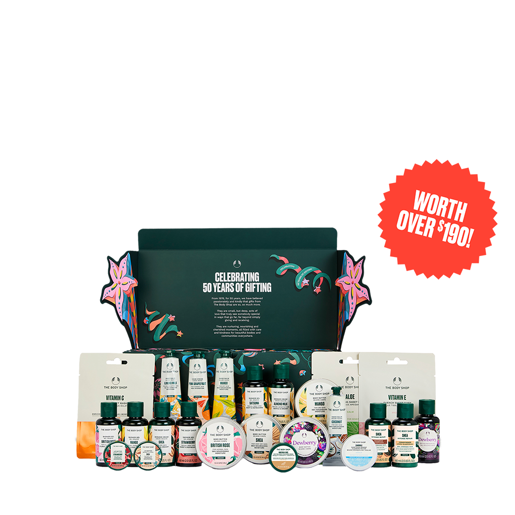 A curated gift set from The Body Shop displayed on a clean white background, featuring a dark green branded box with colorful floral artwork, assorted bottles, jars, and wrapped items arranged in front. A red circular badge in the top right reads 'WORTH OVER $190!'.
