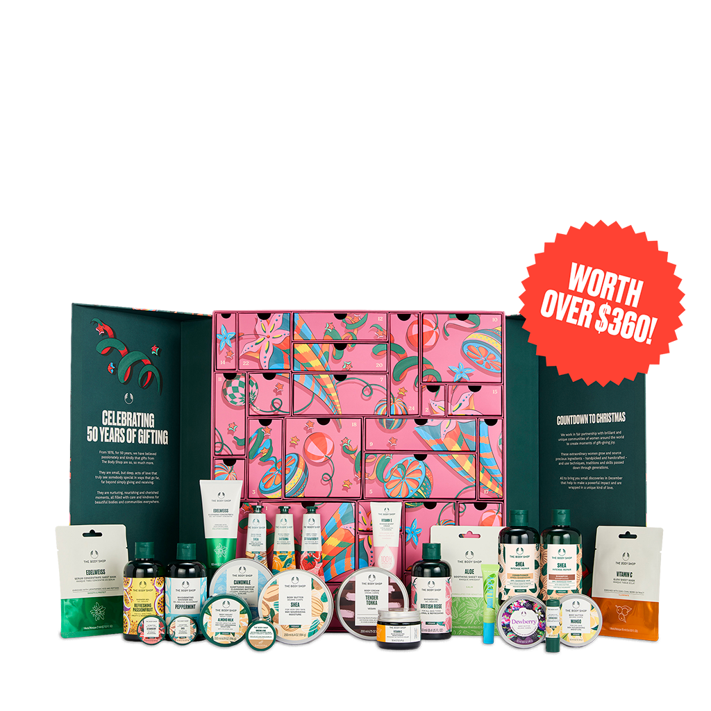 A large gift set display featuring a pink advent calendar with colorful illustrations, flanked by dark green panels with text, and surrounded by assorted bath, body, and skincare products in front. A red circular badge on the right reads 'WORTH OVER $360!'.