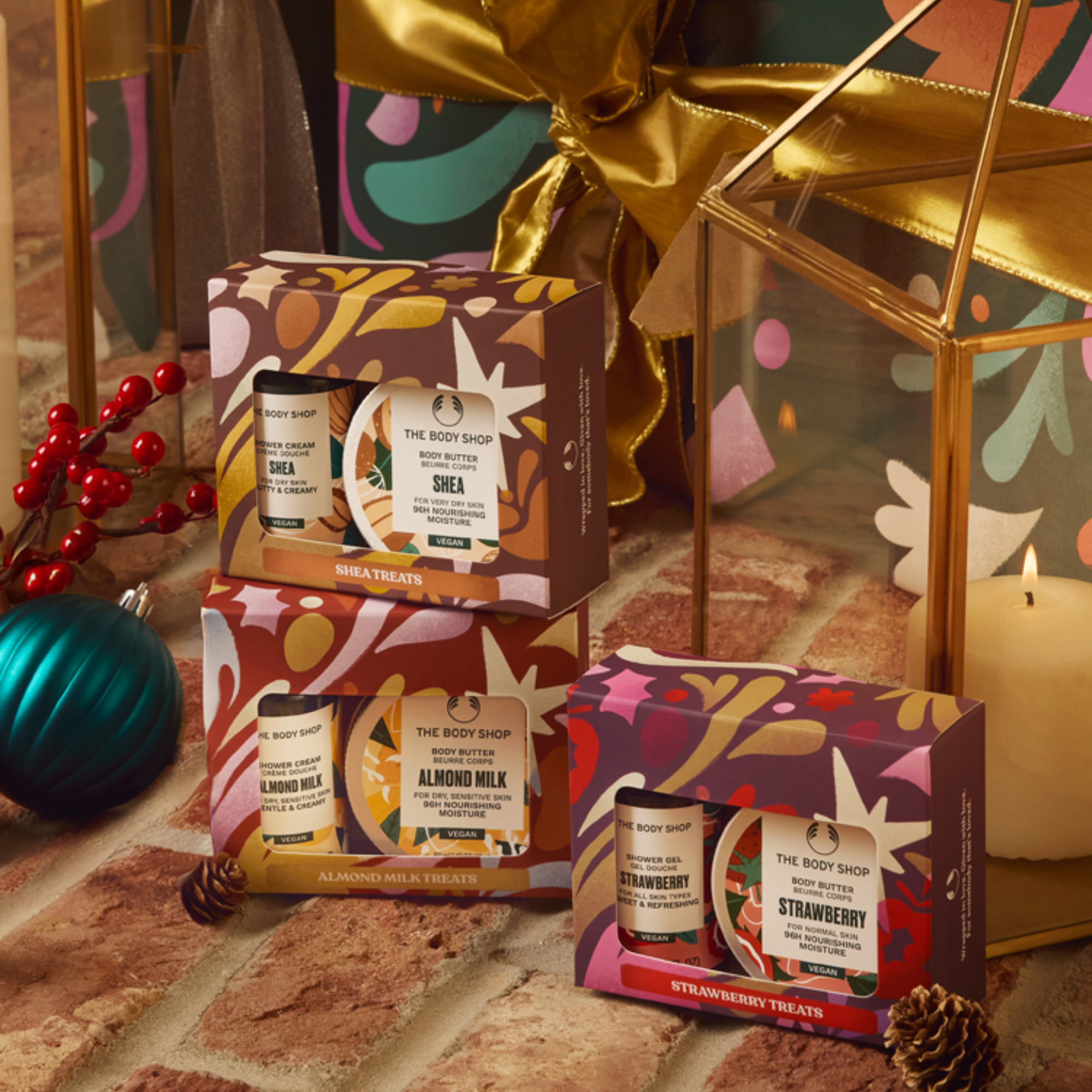 The Body Shop gift sets with decorative elements on a textured surface.