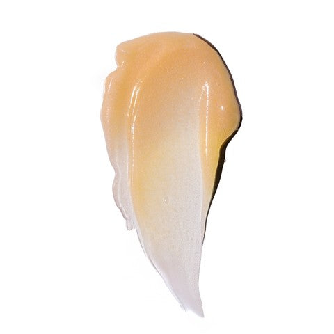 Swatch of light orange coloured cream on a white background