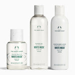 The Body Shop bottles of the white musk EDT, shower gel and lotion on a white background