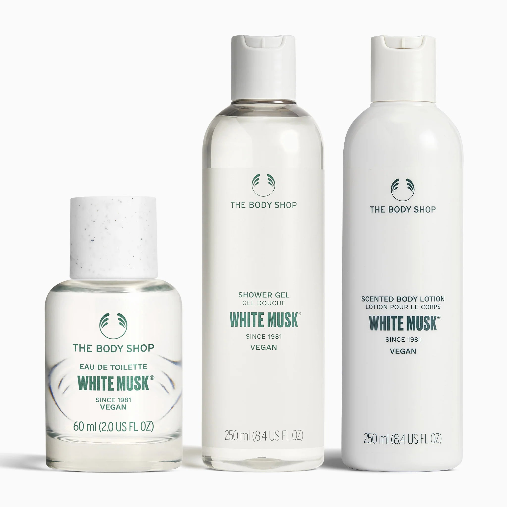 The Body Shop bottles of the white musk EDT, shower gel and lotion on a white background