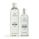 Two bottles of The Body Shop White Musk products on a white background