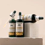 The Body Shop Ginger Scalp Care products on a neutral background