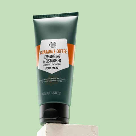 The body shop Guarana and coffee moisturiser on a light green background