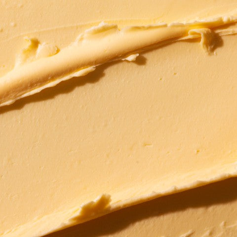 Close-up of a spreadable yellow cream or butter