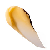 Close up of a orange cream spread on a white background