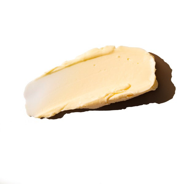 a light orange cream spread on a white background