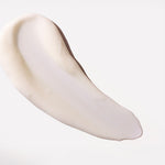 White cream swatch on a light gray background