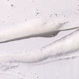 Close-up of clear gel lather on a light gray background