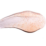 Close-up of a clear orange with specks on a white background