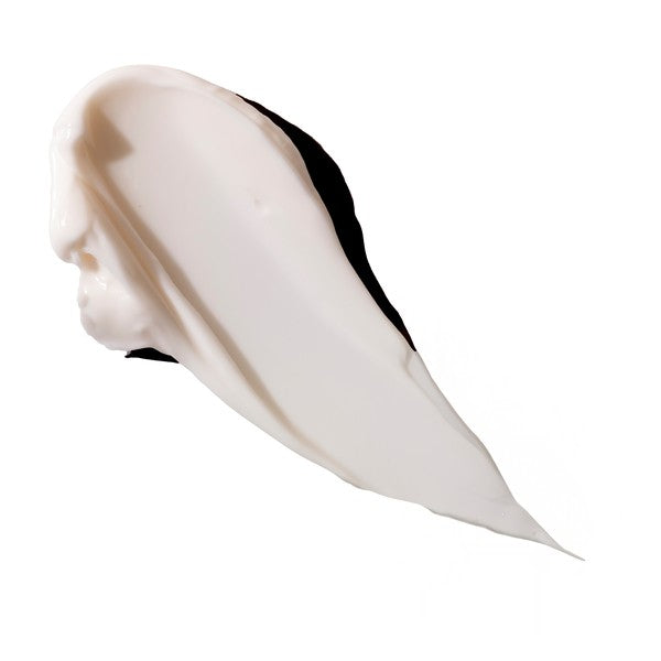 Swatch of a white coloured cream on a white background