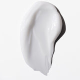 Swatch of a white cream on a white background